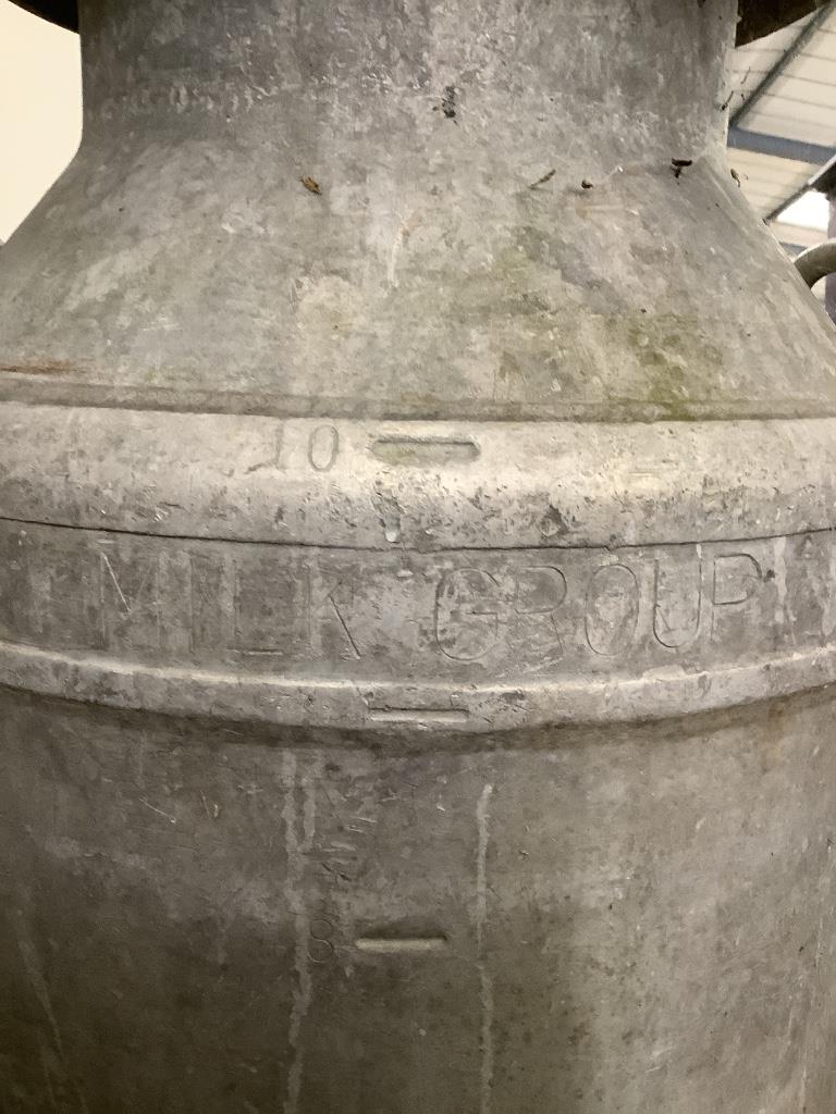 A vintage galvanised milk churn, height 70cm